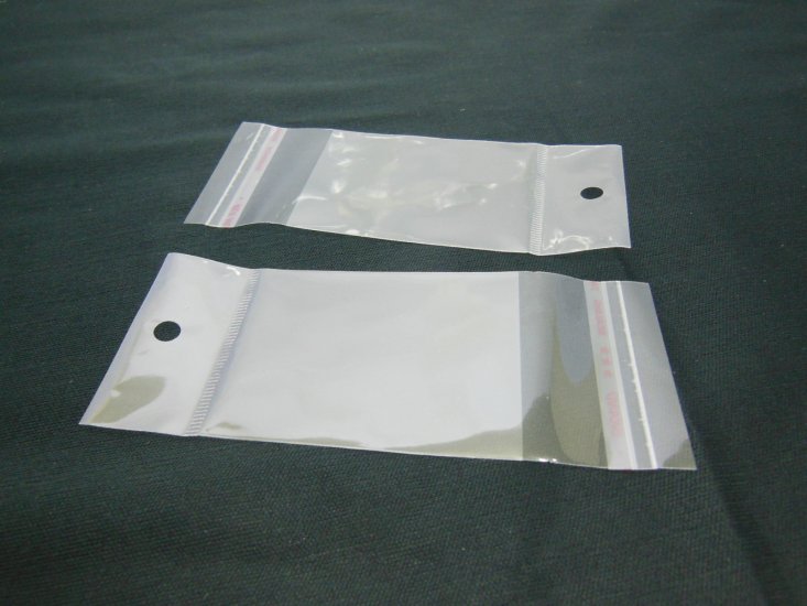 1000 Clear Self-Adhesive Seal Plastic Bags 12x5cm W/Hole - Click Image to Close